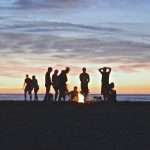 travel buddy finder on the beach with friends