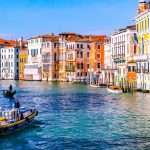 grand canal in Venice in the sun with boat.